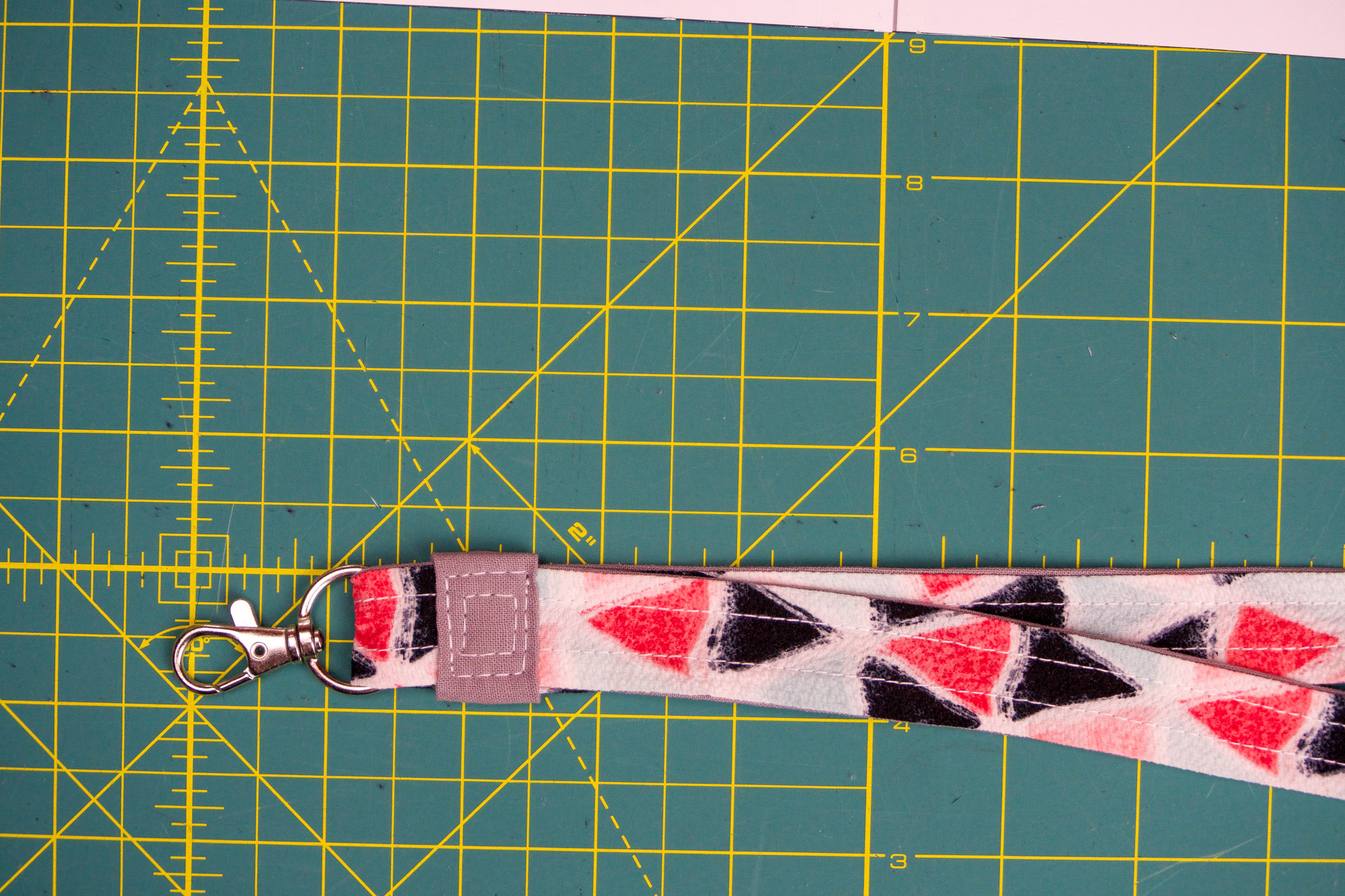 Topstitched tab.