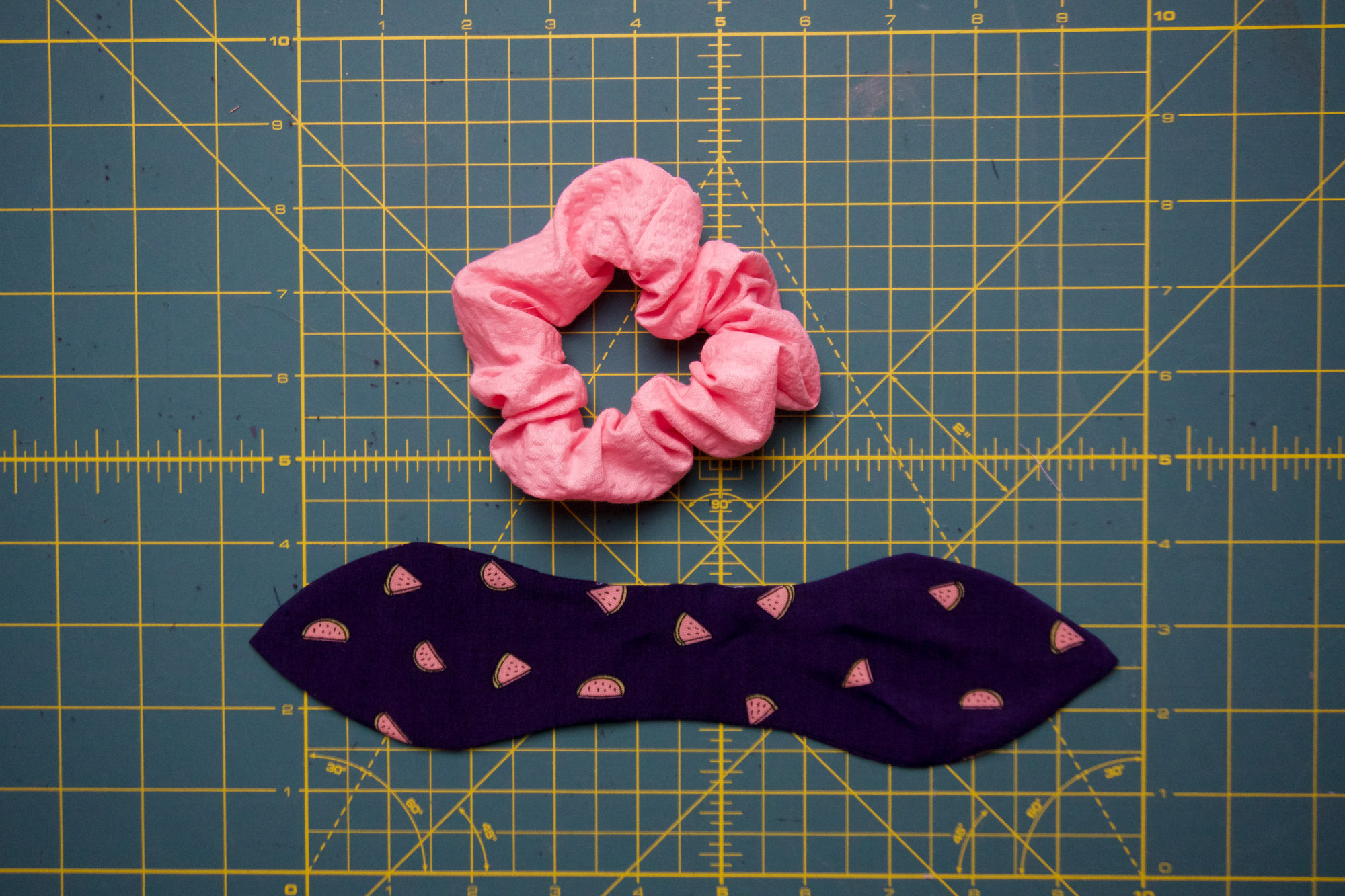 Bow beside a scrunchie.